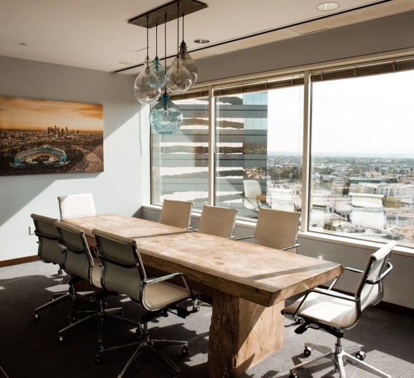 Interior of a corporate conference room with city views.
