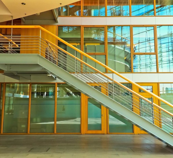 Interior of a commercial building with a long staircase.